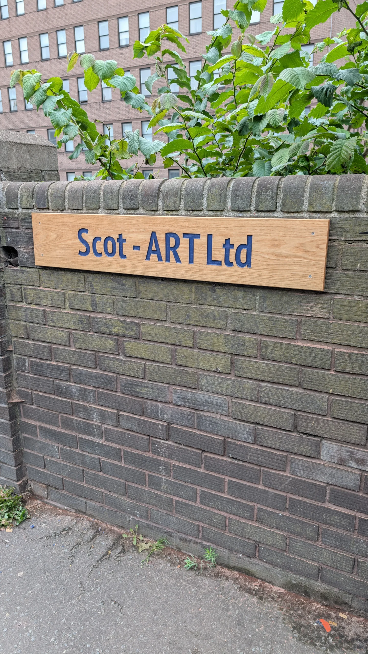 Custom wooden company name sign made in Edinburgh, hand-finished hardwood with engraved lettering.