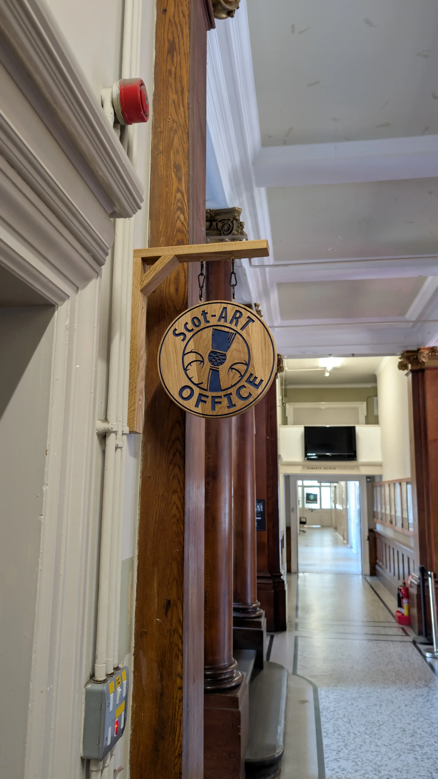 Custom wooden office sign made in Edinburgh, engraved hardwood signage for business interiors.